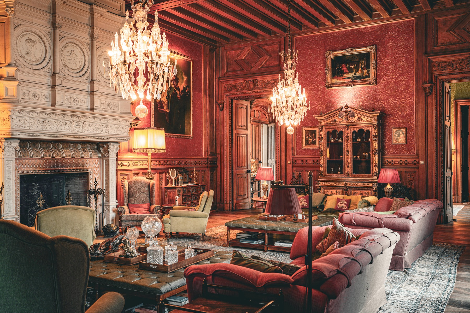 The Grand Salon, set for a wedding reception with chandeliers and fireside seating